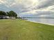 Beautiful waterfront community lake with docks, grassy spaces and lake access for all at 1507 Wheeler Rd, Apopka, FL 32703