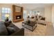 A cozy living room featuring neutral colors and brick fireplace at 1507 Wheeler Rd, Apopka, FL 32703
