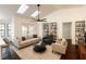 Bright living room with vaulted ceilings, skylights, and cozy furnishings at 1507 Wheeler Rd, Apopka, FL 32703