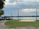 Community volleyball court with sandy area, net, lake views and easy access for residents' enjoyment at 1507 Wheeler Rd, Apopka, FL 32703