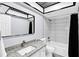 Stylish bathroom featuring a modern vanity, grey tile, and a shower-tub combination at 1913 Poinsetta Ln, Maitland, FL 32751