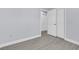 A well-lit bedroom features modern gray floors and neutral-colored walls at 1913 Poinsetta Ln, Maitland, FL 32751