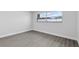 Bedroom featuring gray wood-look flooring, bright natural light, and neutral wall color at 1913 Poinsetta Ln, Maitland, FL 32751