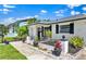 Well-maintained single-story home with lush landscaping, a welcoming entrance, and charming curb appeal at 1913 Poinsetta Ln, Maitland, FL 32751