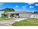 Attractive single-story home offering a manicured lawn and a convenient attached garage at 1913 Poinsetta Ln, Maitland, FL 32751