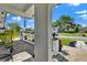 Charming front porch with lush landscaping, decorative plants, and a view of the street and neighboring homes at 1913 Poinsetta Ln, Maitland, FL 32751