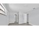 An open hallway featuring neutral wall color and light gray floors at 1913 Poinsetta Ln, Maitland, FL 32751