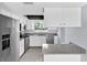 Modern kitchen with stainless steel appliances, granite countertops, and updated cabinetry at 1913 Poinsetta Ln, Maitland, FL 32751