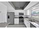 Modern kitchen featuring stainless steel appliances, granite countertops, and updated cabinets at 1913 Poinsetta Ln, Maitland, FL 32751