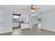 Open concept kitchen and living room with luxury vinyl plank flooring and updated features at 1913 Poinsetta Ln, Maitland, FL 32751