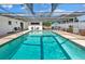 Refreshing screened-in pool featuring a spacious layout, comfortable seating, and a serene atmosphere at 1913 Poinsetta Ln, Maitland, FL 32751