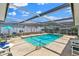 Inviting screened pool area with ample seating, perfect for relaxing and entertaining outdoors at 1913 Poinsetta Ln, Maitland, FL 32751