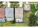 Aerial of adjacent homes shows back yard with pool and screened enclosure, and proximity to neighbors at 8646 La Isla Dr, Kissimmee, FL 34747