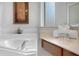 Bright bathroom featuring a soaking tub and neutral finishes at 8646 La Isla Dr, Kissimmee, FL 34747