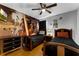 Bedroom featuring Star Wars themed wall decor, ceiling fan, and wood flooring at 8646 La Isla Dr, Kissimmee, FL 34747