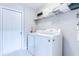 Functional laundry room with modern washer and dryer, and plenty of storage space at 8646 La Isla Dr, Kissimmee, FL 34747