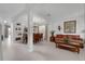 Bright living room with tile flooring, columns, dining area and a comfortable seating area at 8646 La Isla Dr, Kissimmee, FL 34747