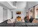 A bright living room boasts high ceilings, a large window with a view, and comfortable furnishings for relaxation at 8646 La Isla Dr, Kissimmee, FL 34747