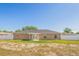 Wide angle view of a private backyard with white fencing and lush grass at 1 Pecan Course Cir, Ocala, FL 34472