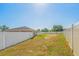 Expansive grassy backyard featuring a sturdy white fence at 1 Pecan Course Cir, Ocala, FL 34472
