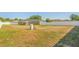 Large backyard enclosed by a white fence on a sunny day at 1 Pecan Course Cir, Ocala, FL 34472