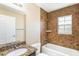 The bathroom has a granite sink and shower with decorative wall tiles at 1 Pecan Course Cir, Ocala, FL 34472