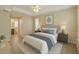 Comfortable bedroom with tile floor, ceiling fan, bathroom access, and lots of natural light at 1 Pecan Course Cir, Ocala, FL 34472
