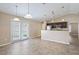 Open concept kitchen with granite countertops, stainless steel appliances, and eating area at 1 Pecan Course Cir, Ocala, FL 34472