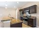 Kitchen featuring granite counters, stainless steel appliances, and dark wood cabinets at 1 Pecan Course Cir, Ocala, FL 34472