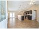 Open concept living room and kitchen featuring modern furnishings and neutral color palette at 1 Pecan Course Cir, Ocala, FL 34472