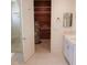 Bathroom with shower, shelving and water heater at 19811 Lake Dorr Rd, Altoona, FL 32702