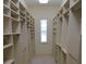 Walk-in closet offers ample storage space with built-in shelving at 19811 Lake Dorr Rd, Altoona, FL 32702