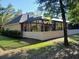 The back of the home shows a screened-in patio and lush backyard at 19811 Lake Dorr Rd, Altoona, FL 32702