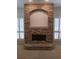 Stone fireplace with a raised hearth and a mantel between windows with plantation shutters at 19811 Lake Dorr Rd, Altoona, FL 32702