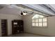 This garage contains a large window with wooden shutters and built in shelving for plenty of storage at 19811 Lake Dorr Rd, Altoona, FL 32702