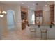 Kitchen featuring a breakfast bar with seating, wooden cabinets and stainless refrigerator at 19811 Lake Dorr Rd, Altoona, FL 32702