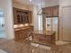 Spacious kitchen featuring granite countertops, wooden cabinetry, and stainless steel appliances at 19811 Lake Dorr Rd, Altoona, FL 32702