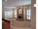 Open living area with stone fireplace and large windows for natural light at 19811 Lake Dorr Rd, Altoona, FL 32702