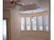 Bright and airy living room with lots of windows and a chandelier at 19811 Lake Dorr Rd, Altoona, FL 32702