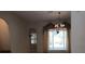 Living room featuring a chandelier, window with curtains, and a doorway at 19811 Lake Dorr Rd, Altoona, FL 32702