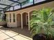 Covered patio features brick pavers, columns and tropical landscaping for a relaxing atmosphere at 19811 Lake Dorr Rd, Altoona, FL 32702