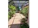 Brick-paved patio features a screened enclosure and tropical landscaping at 19811 Lake Dorr Rd, Altoona, FL 32702