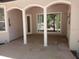 Covered patio features brick pavers and elegant columns at 19811 Lake Dorr Rd, Altoona, FL 32702