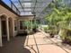 Spacious outdoor patio with screened enclosure and lush landscaping at 19811 Lake Dorr Rd, Altoona, FL 32702
