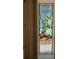 Stained glass window with an intricate floral design providing a unique artistic accent at 19811 Lake Dorr Rd, Altoona, FL 32702