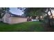 A spacious backyard with a screened porch, perfect for outdoor entertaining and enjoying the natural surroundings at 1524 New Jersey Oaks Ct, Lakeland, FL 33801