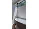 Bright bathroom with a freestanding tub under a modern light fixture and a large skylight at 1524 New Jersey Oaks Ct, Lakeland, FL 33801