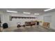 Spacious garage with overhead lighting and workbenches at 1524 New Jersey Oaks Ct, Lakeland, FL 33801