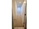 Hallway leading to bedroom with carpet flooring at 1524 New Jersey Oaks Ct, Lakeland, FL 33801