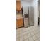 An array of stainless steel appliances with granite countertops and wooden drawers at 1524 New Jersey Oaks Ct, Lakeland, FL 33801